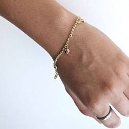 Photo of worn Bracelet with 7 pendants 3 Moons 2 Hearts 2 Stars in Three Colors