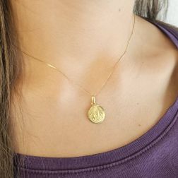 Photo of worn Our Lady of Lourdes yellow gold pendant size S