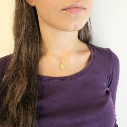 Photo of worn Our Lady of Lourdes yellow gold pendant size S