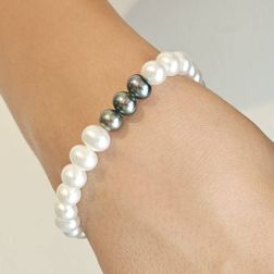 Photo of worn Fresh Water pearls bracelet White and Grey with 18kt White Gold clasp