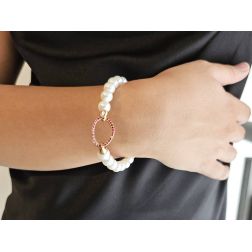 Photo of worn Fresh Water pearls bracelet with Rubies on 18kt Rose Gold clasp