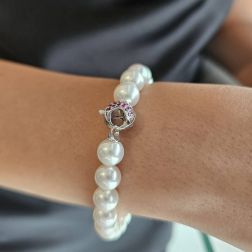 Photo of worn Akoya pearl bracelet with Diamonds and Rubies on 18kt White Gold clasp