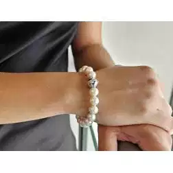 Photo of worn Fresh Water pearl bracelet Spherical clasp with diamonds in 18kt White Gold