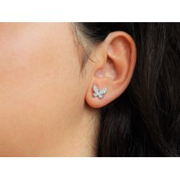 Photo of worn Flying Butterfly Earrings in White Gold and Diamonds
