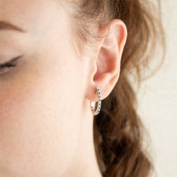 Photo of worn Oval Diamonds and Emeralds Hoops