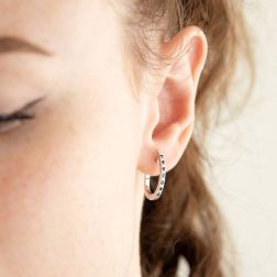 Photo of worn Oval Diamonds and Blue Sapphires Hoops