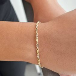 Photo of worn Torchon and Sphere Chain Bracelet in 18kt Yellow and White Gold