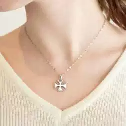 Photo of worn Templar Cross in 18kt White Gold