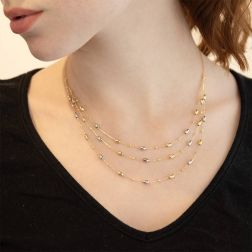 Photo of worn Three-strand Necklace with Barrels in Yellow and White Gold