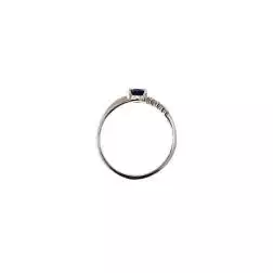 Anello Solitario con Zircone Blu contornato da Zirconi Bianchi oro Bianco
