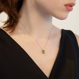 Photo of worn 18kt White Gold 10x8mm Oval Peridot and 3 Diamonds Point Light Necklace