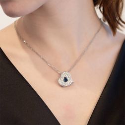 Photo of worn Diamonds with Blue Sapphire Heart Necklace