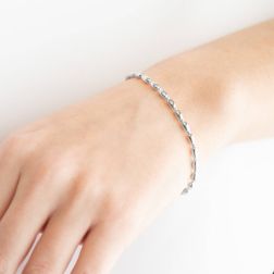 Photo of worn Bracelet with alternating barrels in 18kt White Gold