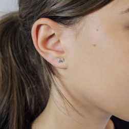 Photo of worn Bow shaped earrings 18kt white gold and zircons