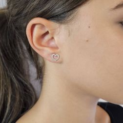 Photo of worn Heart shaped earrings 18 kt white gold and zircons