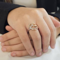 Photo of worn Little Hug Ring in 18kt white and rose gold