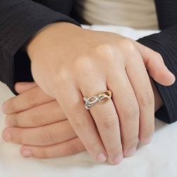 Photo of worn Long Hug Ring in 18kt white and rose gold