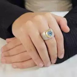 Photo of worn Heart Shaped Azure Topaz Ring White and Yellow Gold