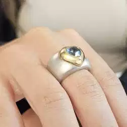 Photo of worn Heart Shaped Azure Topaz Ring White and Yellow Gold