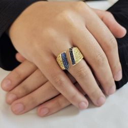 Photo of worn Ring with Blue and Yellow Gold Zircons