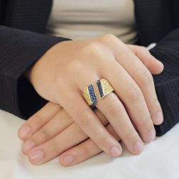 Photo of worn Ring with Blue and Yellow Gold Zircons