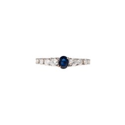 Solitaire Ring surrounded by Sapphire and Diamonds in White Gold