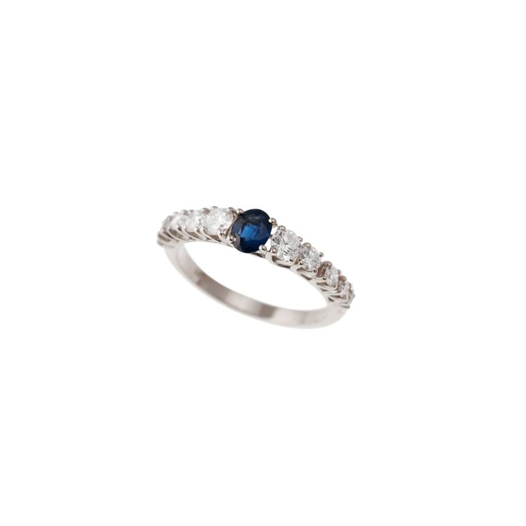 Solitaire Ring surrounded by Sapphire and Diamonds in White Gold