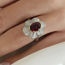 Photo of worn White and Yellow Gold Solitaire Ruby Ring Surrounded with Diamonds
