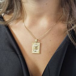Photo of worn King of spades Card Pendant with enamel and zircons on yellow gold