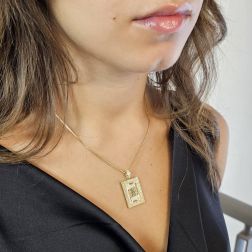 Photo of worn King of spades Card Pendant with enamel and zircons on yellow gold