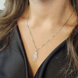 Photo of worn Tall Baby-boy charm in 18kt white gold with zircons
