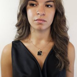 Photo of worn Square pendant Black Onyx with Rose Gold border