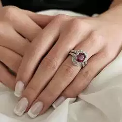 Photo of worn White Gold Solitaire Band Ring with Ruby and Diamonds