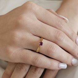 photo of worn White and Yellow Gold Solitaire Ring with Ruby