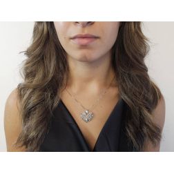 Photo of worn Domed Holed Heart shaped Charm 18kt white gold
