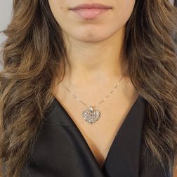 Photo of worn Domed Holed Heart shaped Charm 18kt white gold