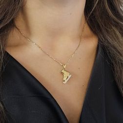 Photo of worn Ice Skate pendant yellow and white gold