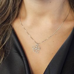 Photo of worn Woven Wire Flower Charm with zircons in white gold