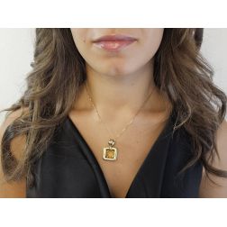 Photo of worn Yellow Gold Square pendant with Round Faceted Citrine Topaz