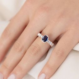 photo of worn Oval Sapphire and Baguette Diamond Solitaire Ring