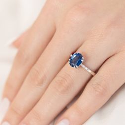 photo of worn Solitaire Ring with Sapphire and 4 Diamonds