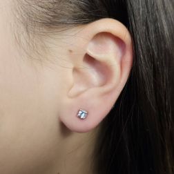 Photo of worn Solitary Studs earrings with round 3,75mm acquamarines in white gold