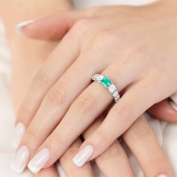 photo of worn Octagonal Emerald Ring surrounded by scaled Diamonds