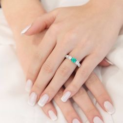photo of worn Octagonal Emerald Ring surrounded by scaled Diamonds