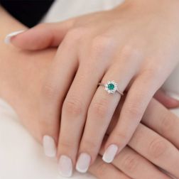 photo of worn Solitaire with Emerald Flower and 8 White Gold Diamonds