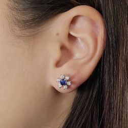 Photo of worn Blue Sapphire and Diamond Snow Flake Earrings
