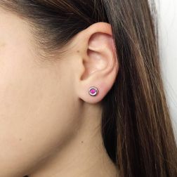 Photo of worn Ruby round bezel earrings 7mm White Gold