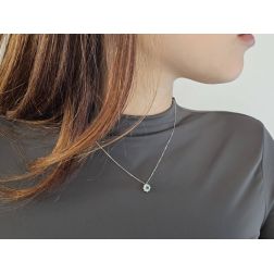 Photo of worn Flower Necklace with 0.12ct Emerald and Diamonds in White Gold