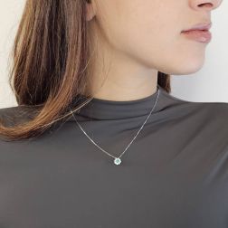 Photo of worn Flower Necklace with 0.12ct Emerald and Diamonds in White Gold