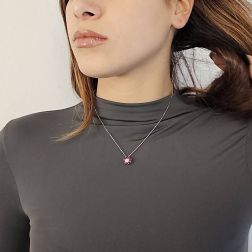 Photo of worn Flower Necklace with 0.29ct Diamond and Rubies in White Gold
